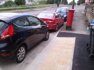 Car parked across dropped kerb on Claywood Road